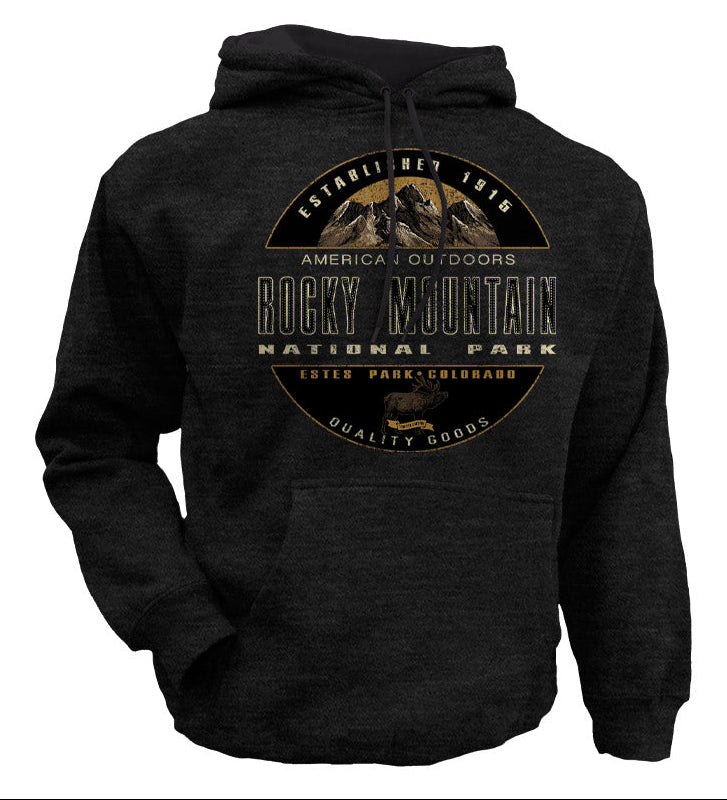 A charcoal hoodie shown from the back with a large circular 'Rocky Mountain National Park' graphic printed in tan and black. The top half shows a close-up of the same print on a dark fabric background, with text above describing the product.